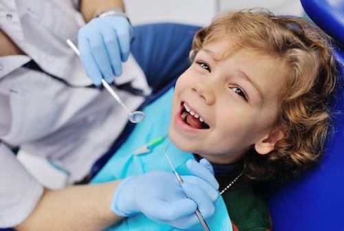 curly-boy-at-dentist-laughing.jpeg